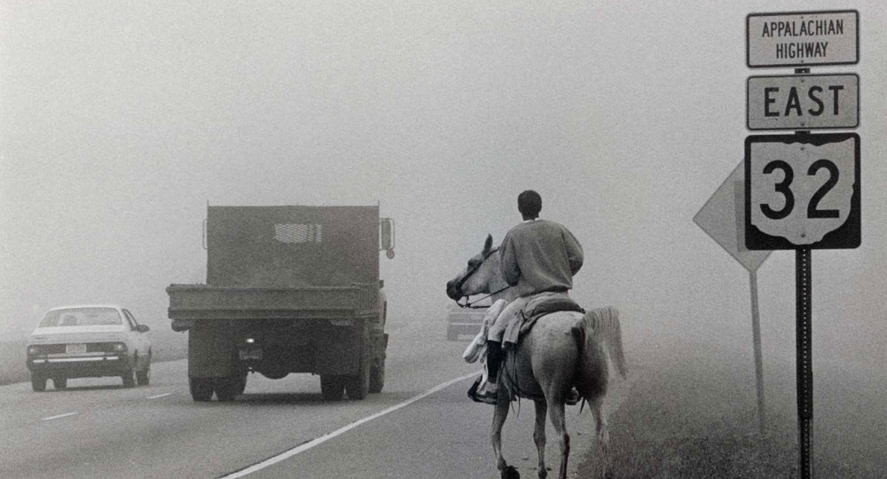 Lucian Spataro on horseback on foggy appalachian highway